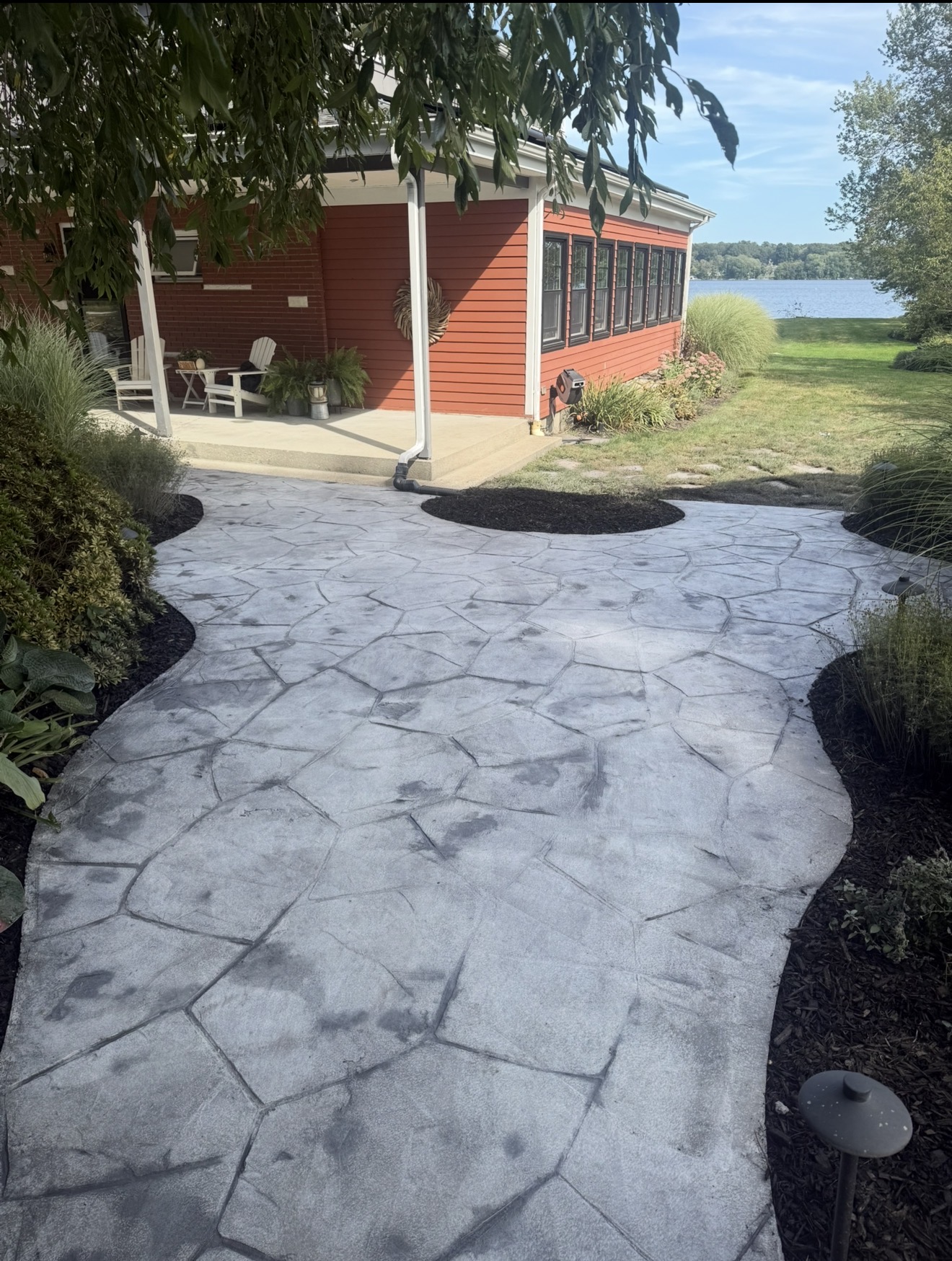 Stone walkway and landscaped beds